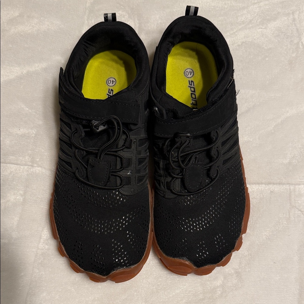 Barefooted Black and Brown women’s  Athletic Shoes